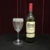 High-end suspended wine pouring (bottle + stemmed glass)